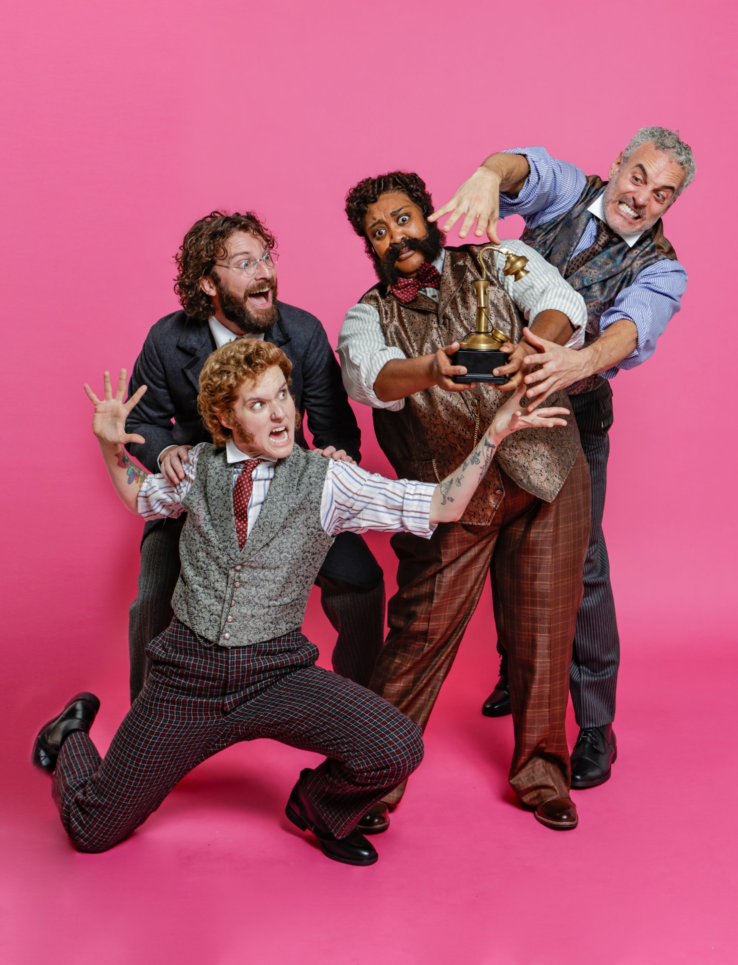 Four Ahoy-Hoy cast members in period waistcoats reach for an antique telephone against a bright pink backdrop.