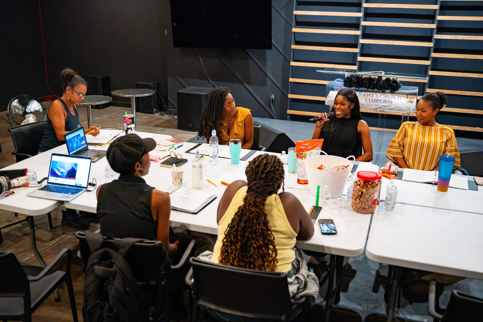 The cast and creative team of The Wash gathered around a rehearsal table at The Studio
