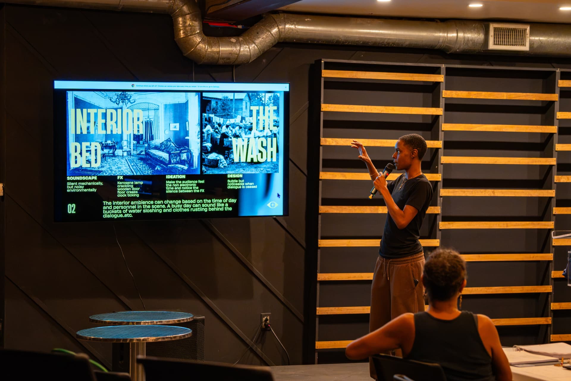 A designer presents soundscape and design concepts for The Wash during rehearsal at The Studio