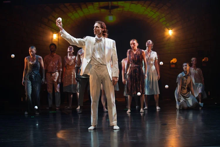Tampa City Ballet dancers perform La Septima, with a soloist in a white suit in front of the company